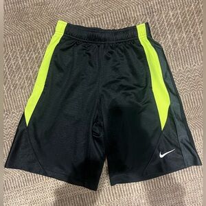 NIKE Black Athletic shorts with green stripe, size Youth S